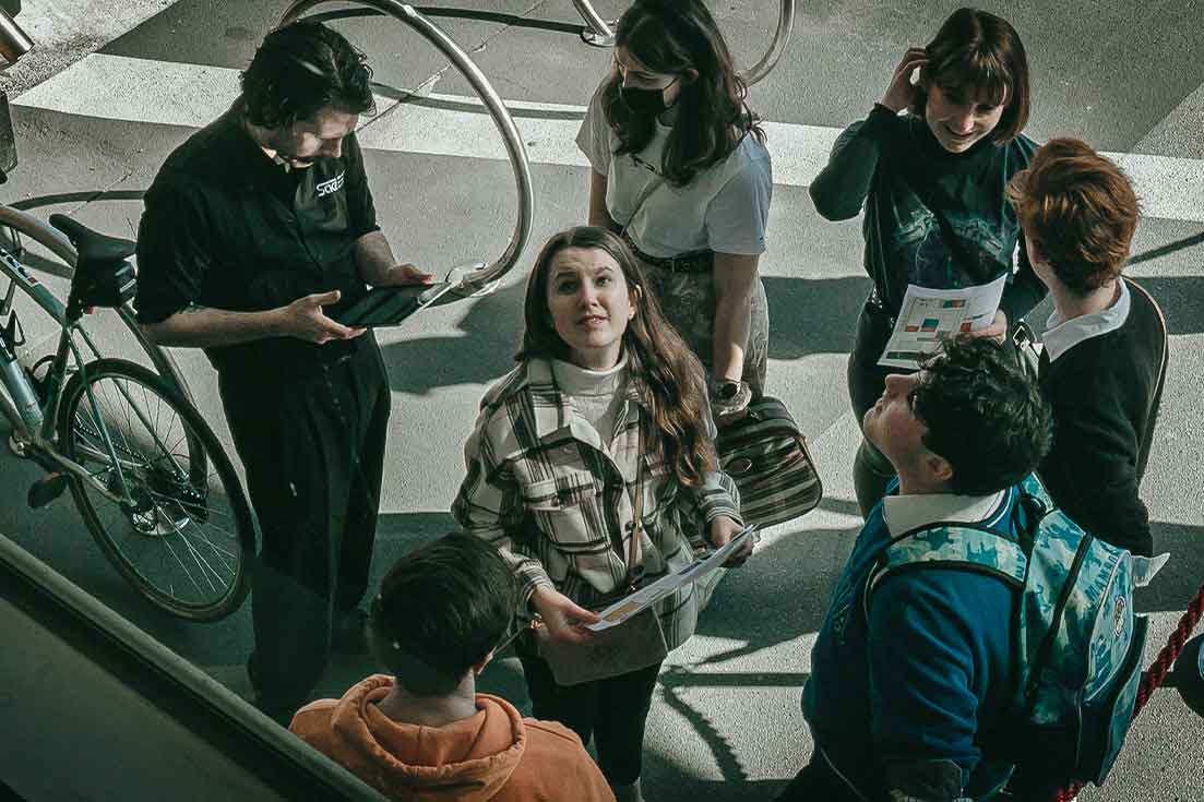 Attendee at an SAE event looking up at signage and the facilities on campus