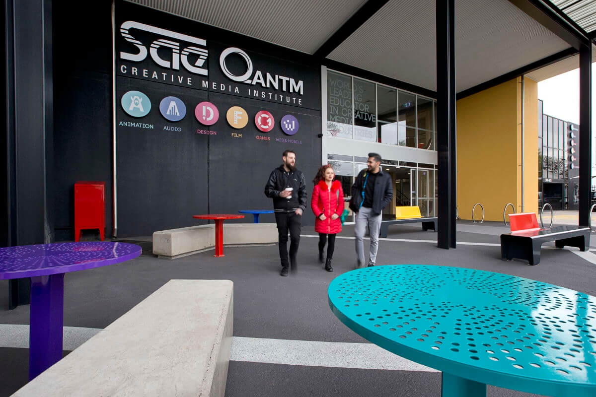 Three students walking outside SAE Melbourne campus