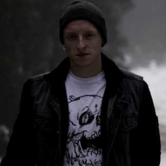 Man wearing jacket with earring