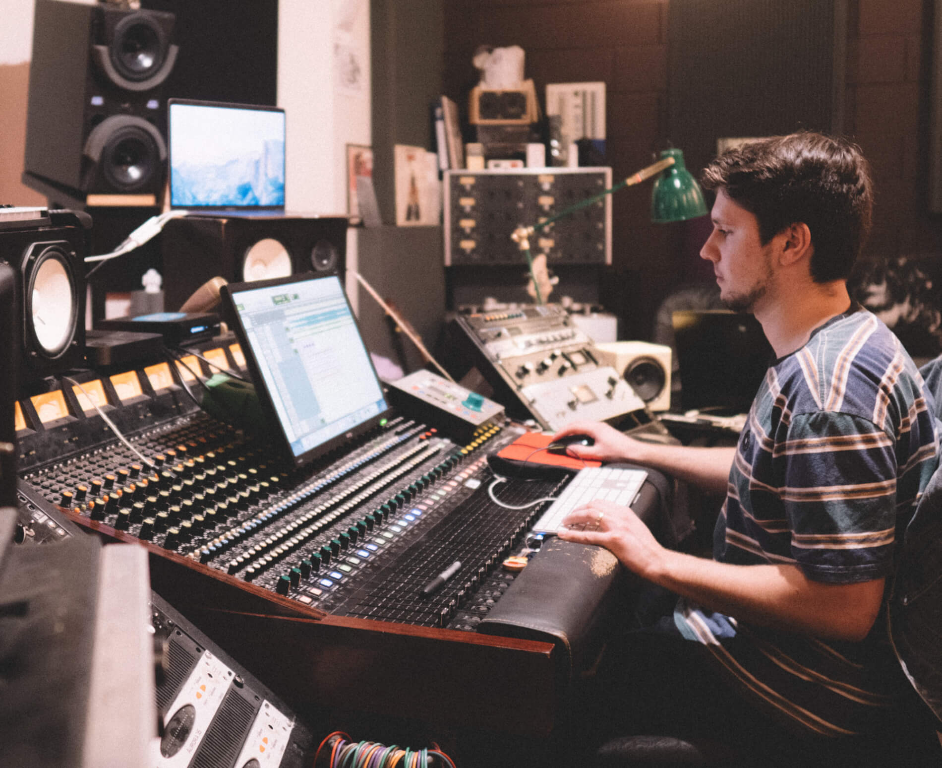 Man working on sound desk