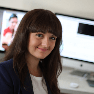 Woman sitting in front of computer.