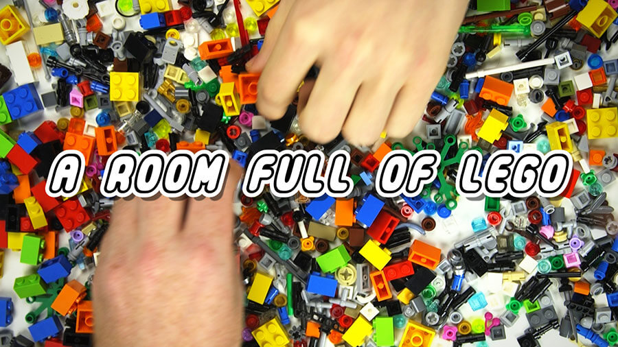 Hands over a pile of assorted lego bricks. Text reads: A Room Full of Lego