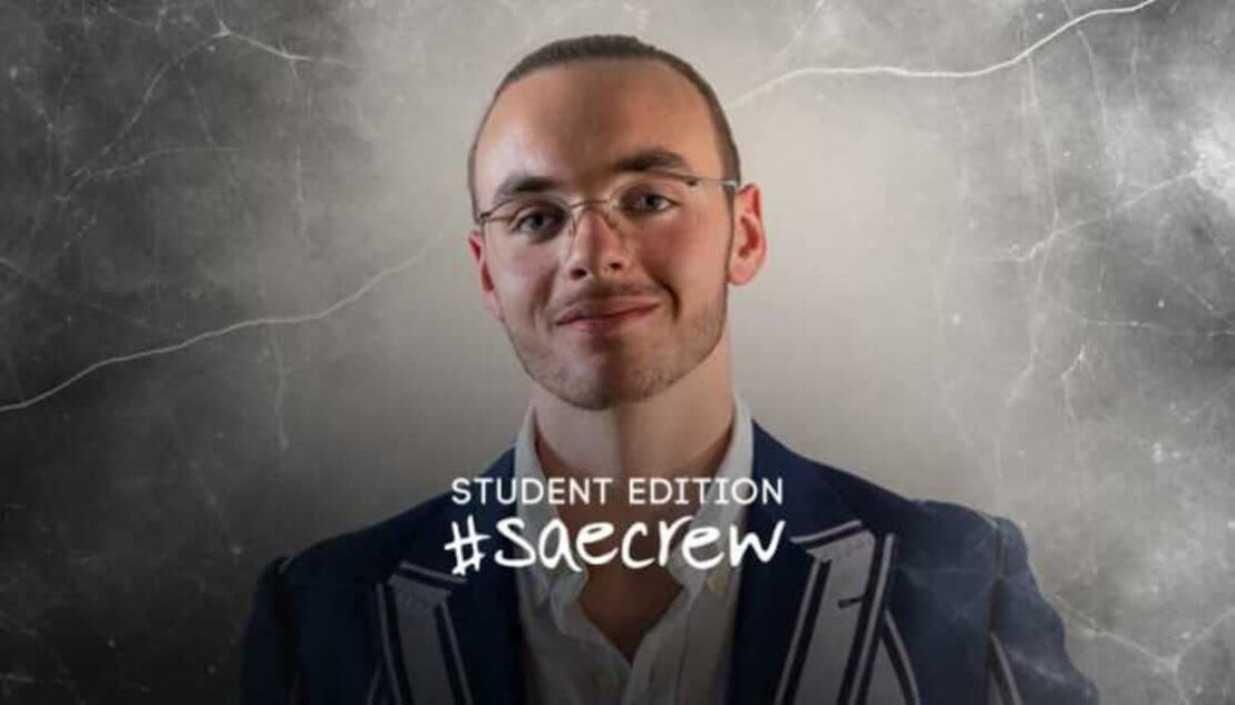 Student wearing blazer and glasses. Text reads Student Edition #SAEcrew