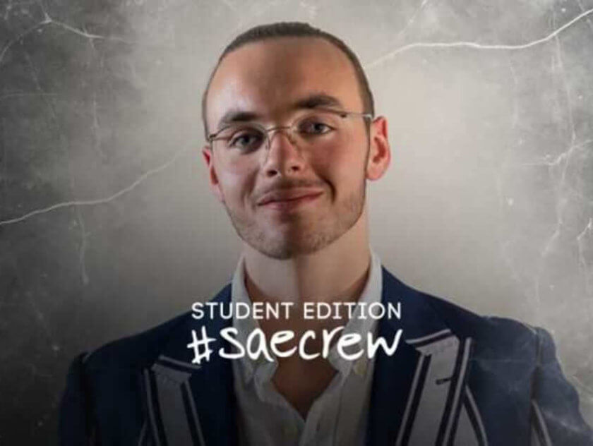 Student wearing blazer and glasses. Text reads Student Edition #SAEcrew