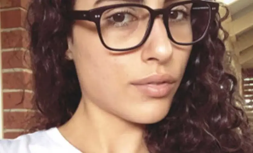 Closeup image of female wearing glasses