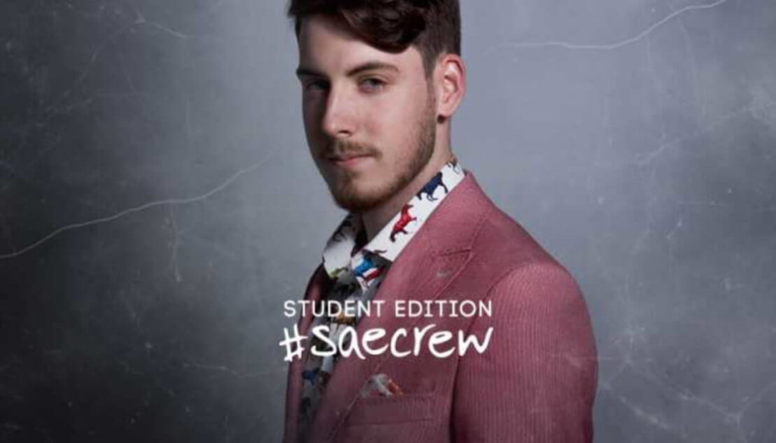 Student wearing salmon colour blazer. Text reads Student Edition #SAEcrew