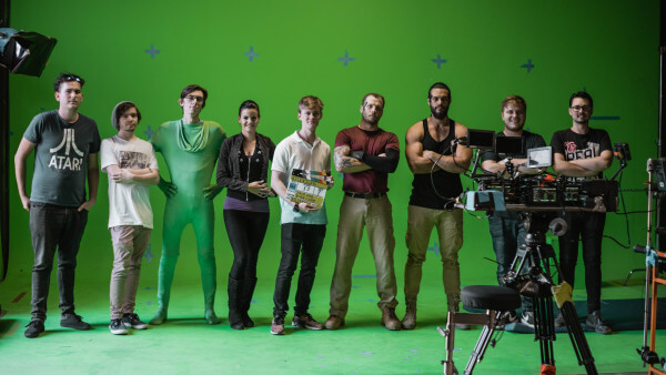 Group of students in front of green screen