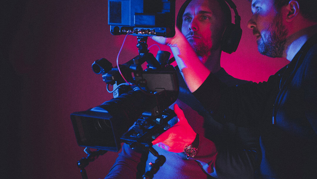 Film lecturer explains film equipment to student
