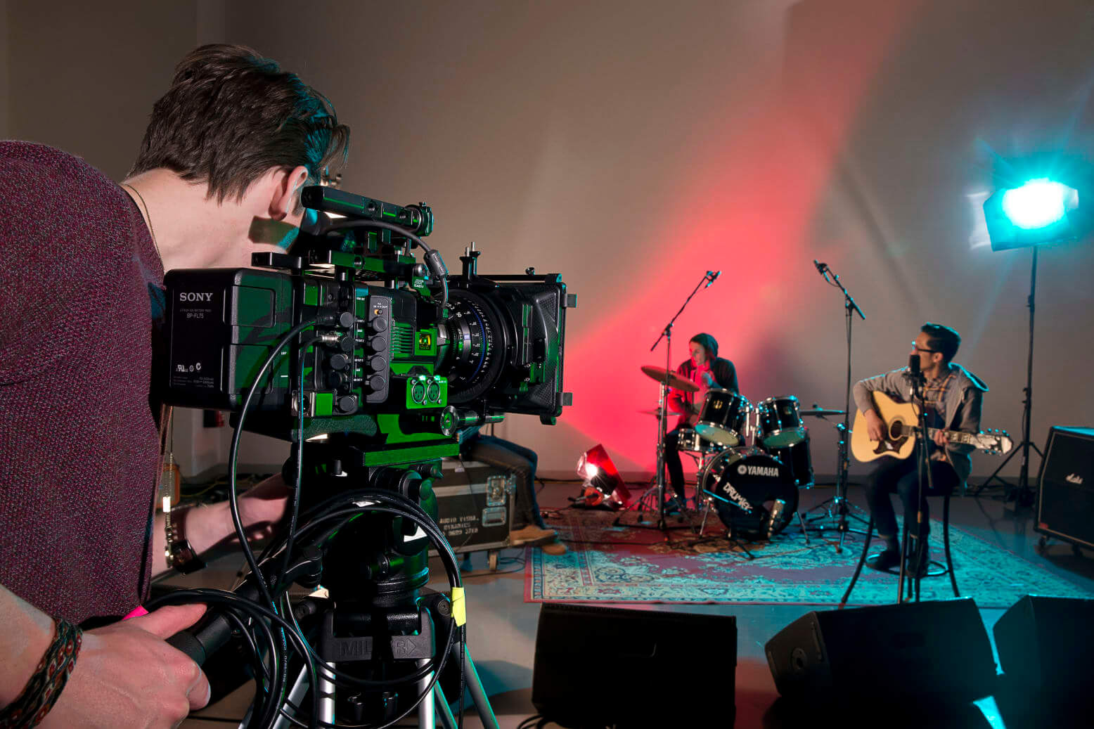Film student filming musicians