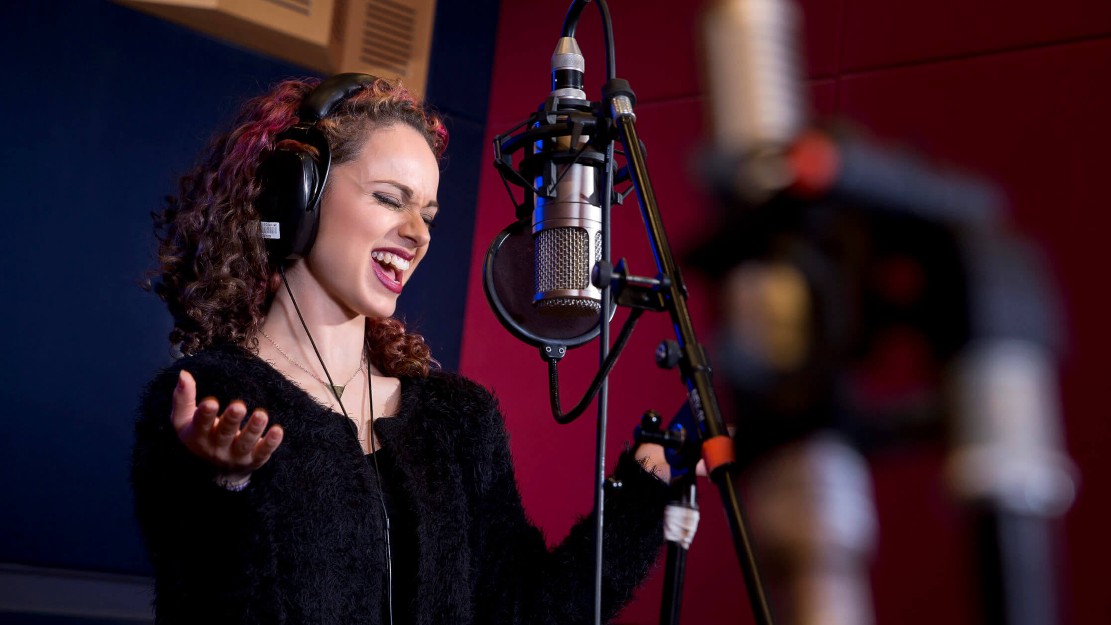 Student singing in studio