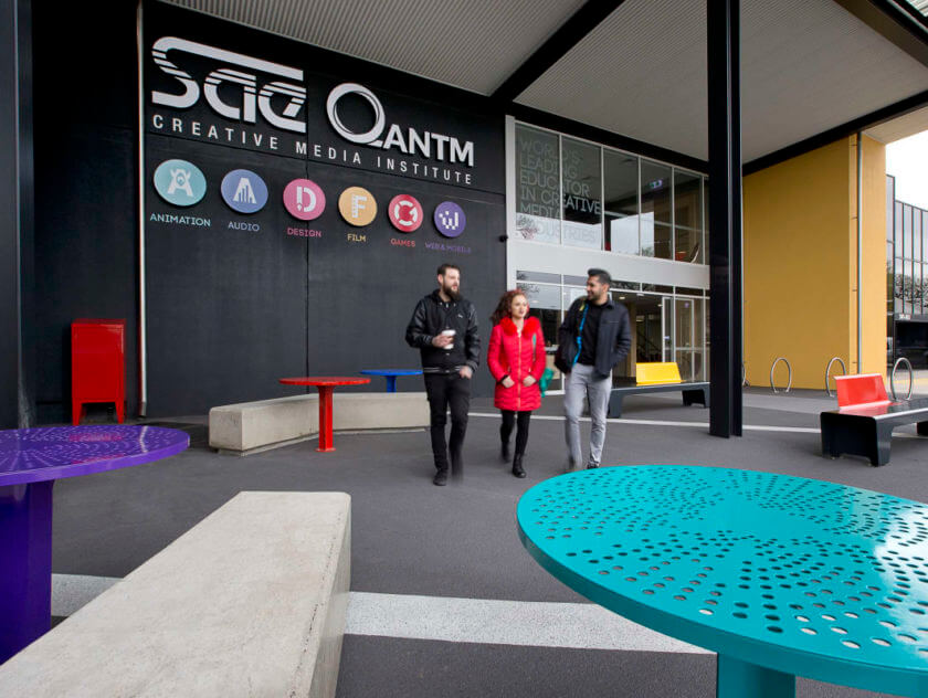 Three students walking outside SAE Melbourne campus