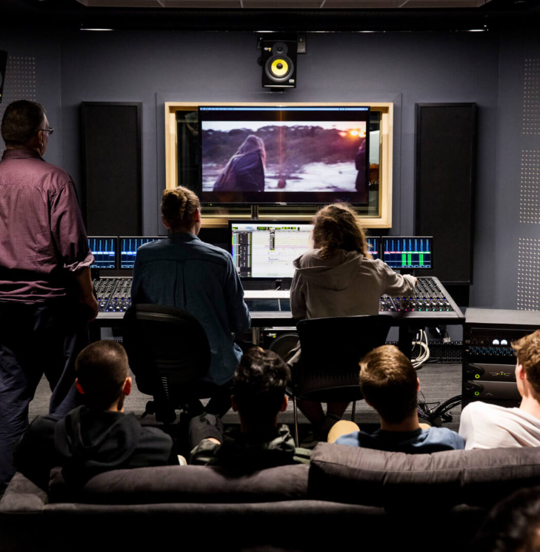 Film Students with Lecturer in Post Production Room