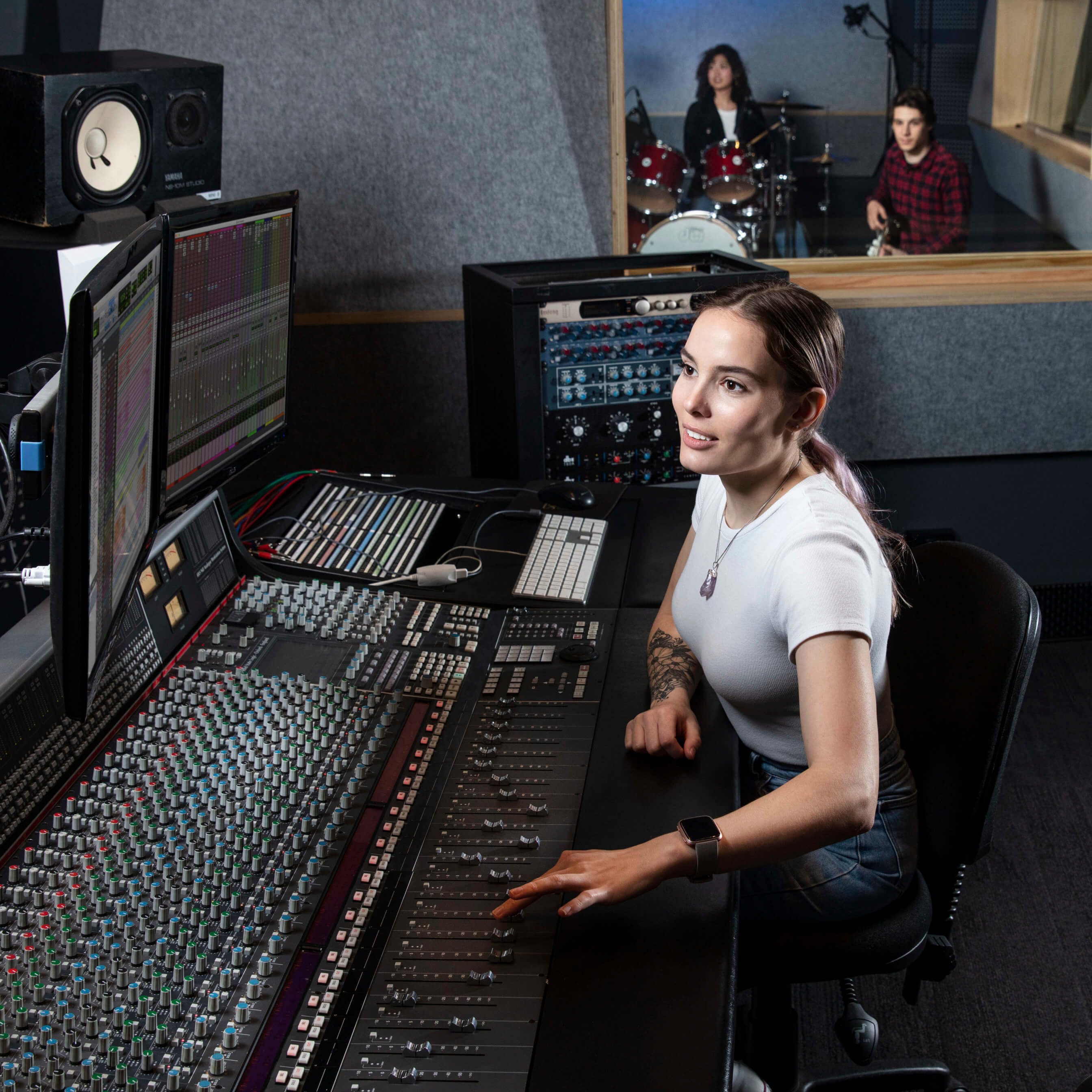 SAE_AUS_Image_SYD_Music_Female_Focus_Student_on_Audio_Desk SAE Student on Audio Desk