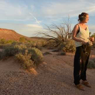 Sound engineer standing in a desert