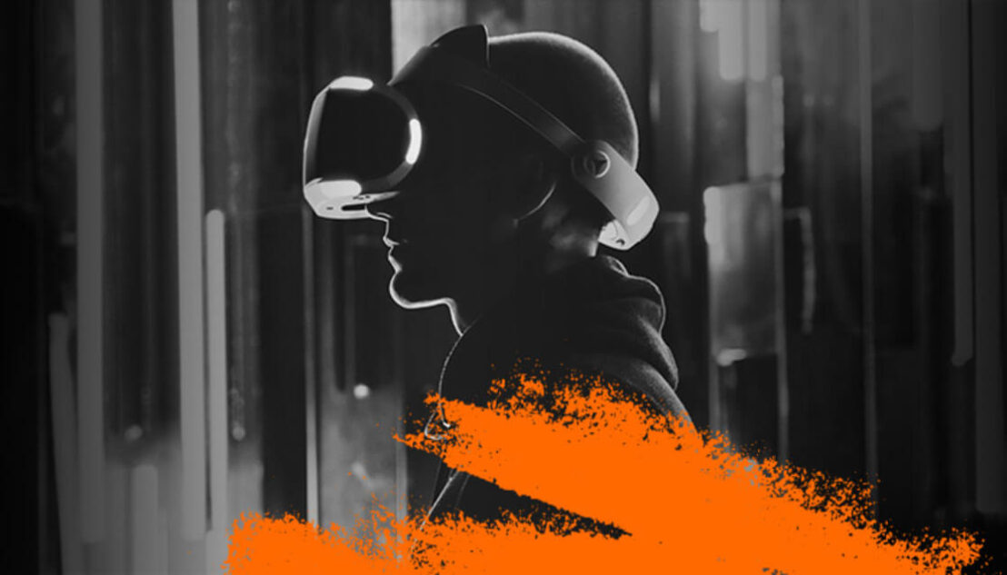 Black and white image of person wearing VR headset