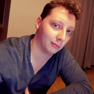 Man named Rhys Sellars looking at camera