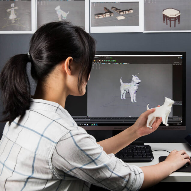 Person working with a 3D printed dog