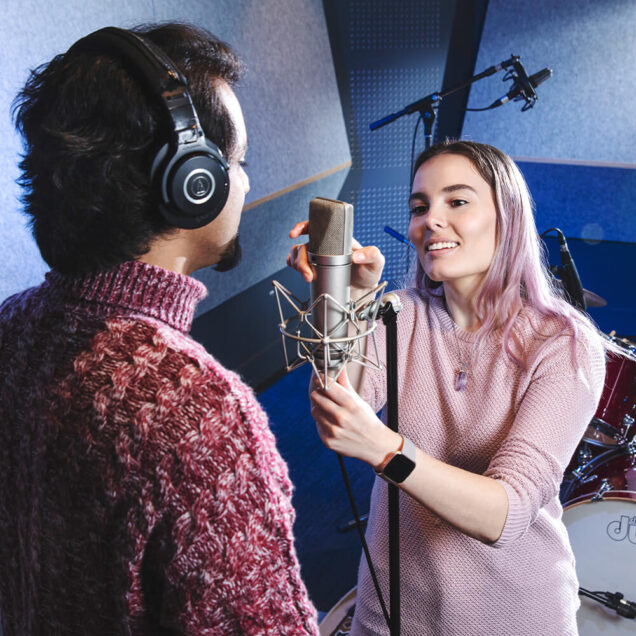 Sound technician fixing a microphone