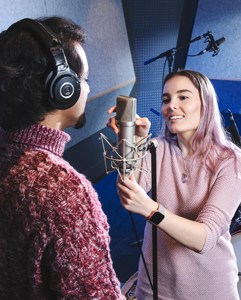 Sound technician fixing a microphone