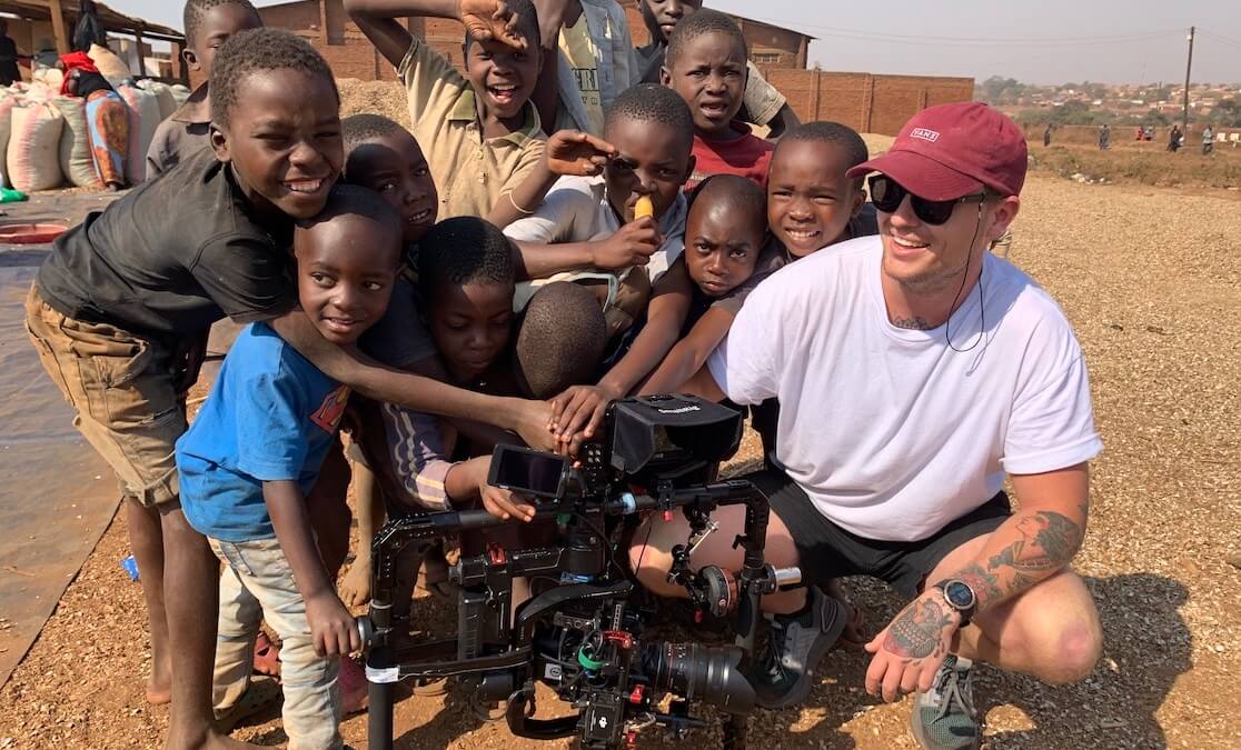 Josh filming with children in Kenya