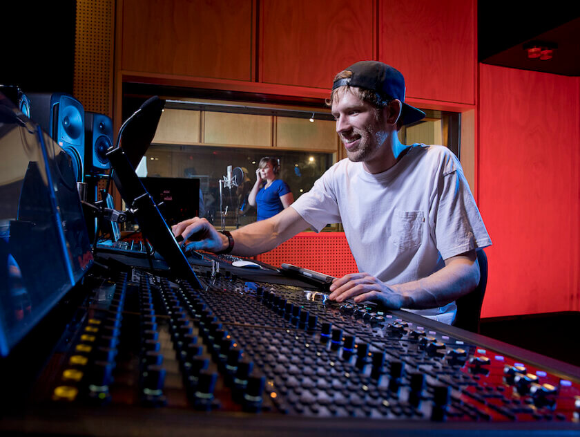 Male student at audio desk