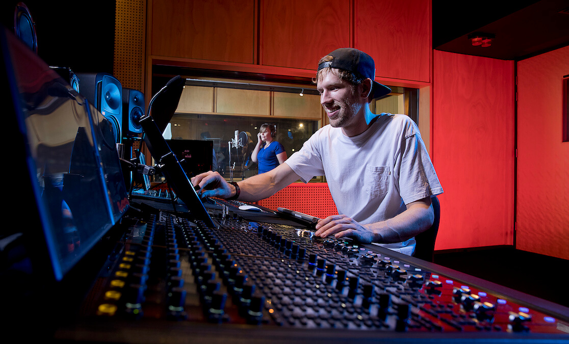 Male student at audio desk