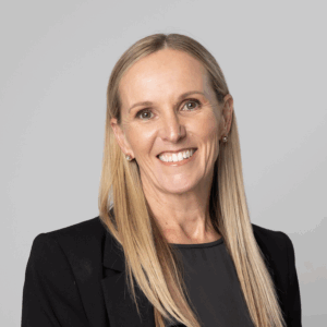 Woman smiles at camera. Professional headshot of Fiona West
