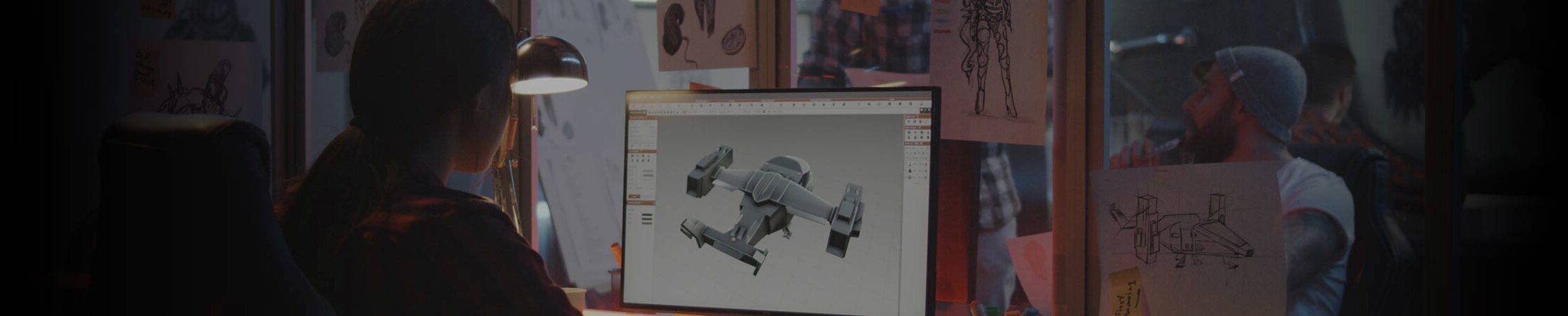 Animation Courses | SAE University College Person sitting at computer monitor with 3D model on screen. Animation Courses at SAE University College