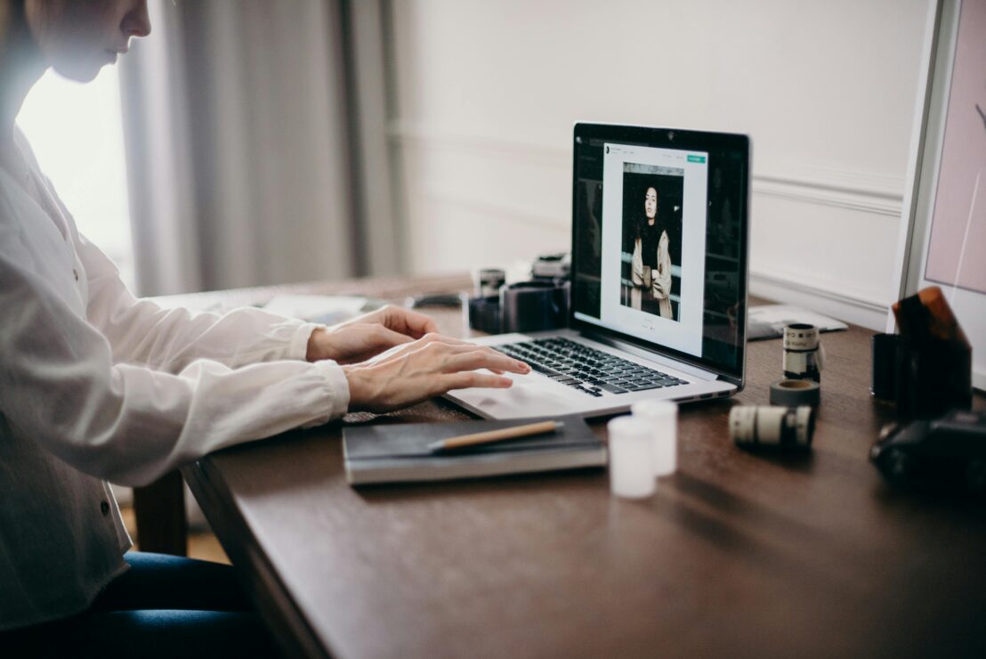 Woman using laptop to review images