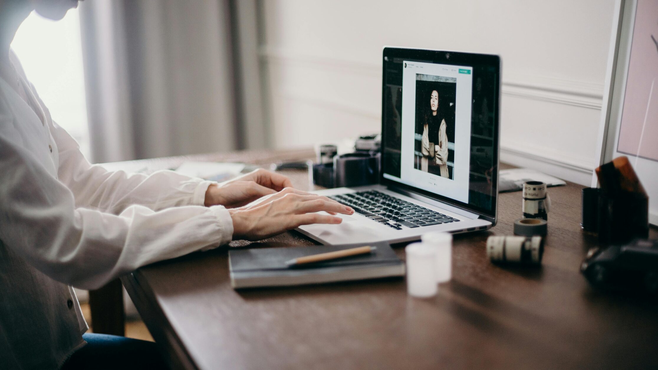 Woman using laptop to review images