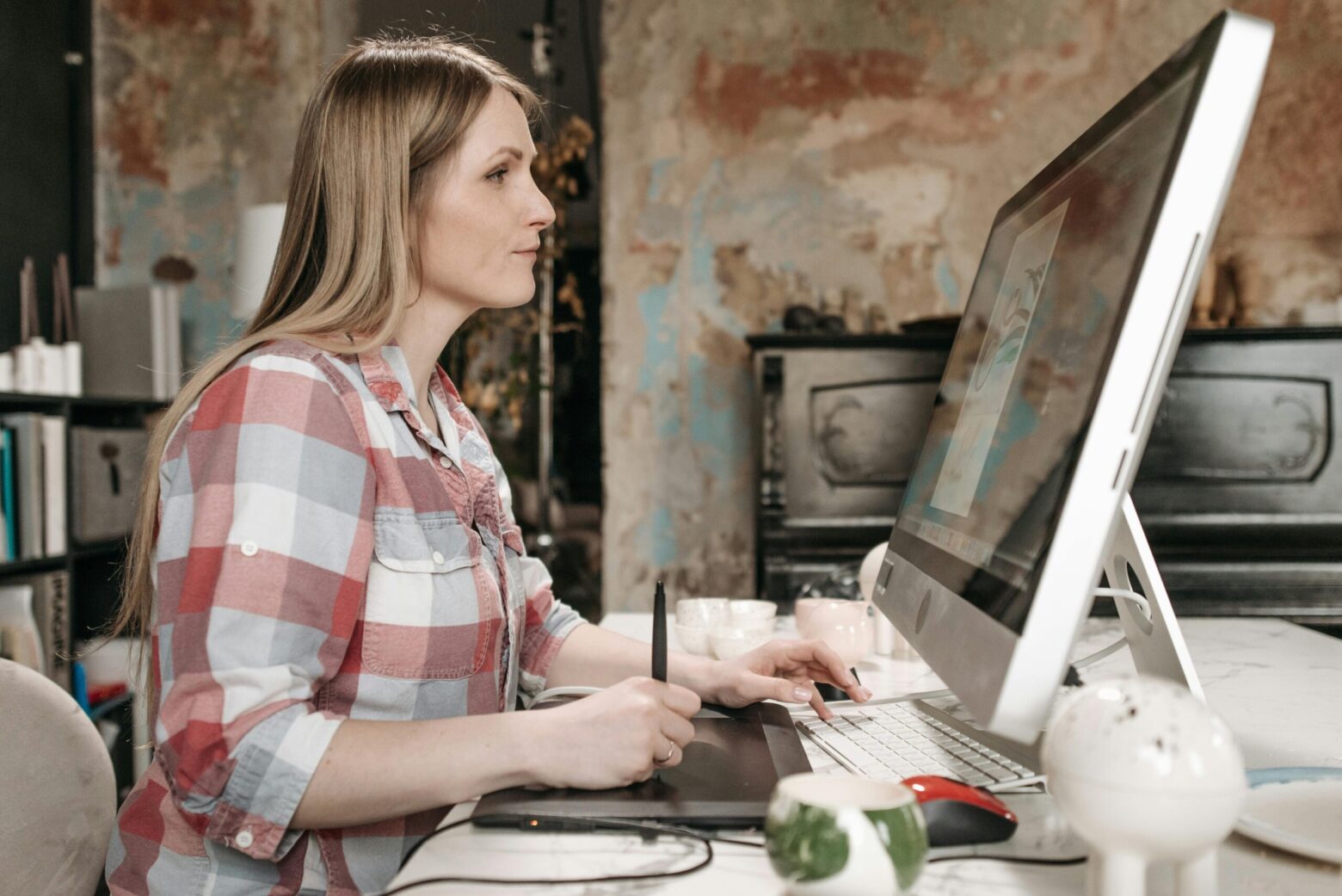 Woman using Mac computer