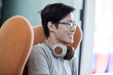 SAE Brisbane student with headphones