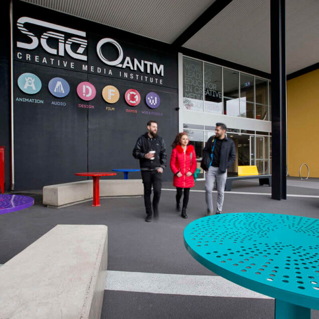 Three students walking outside SAE Melbourne campus