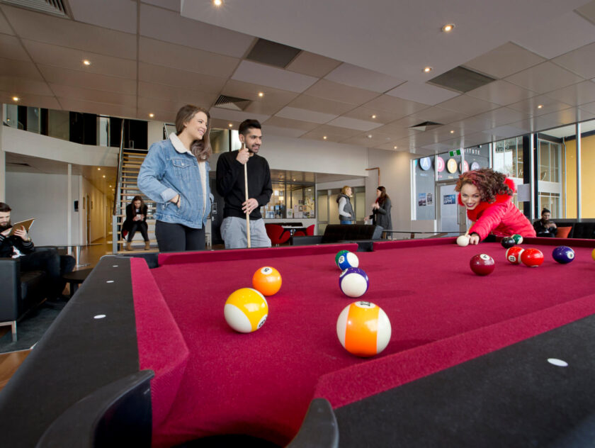 Students playing pool. SAE Melbourne student common area