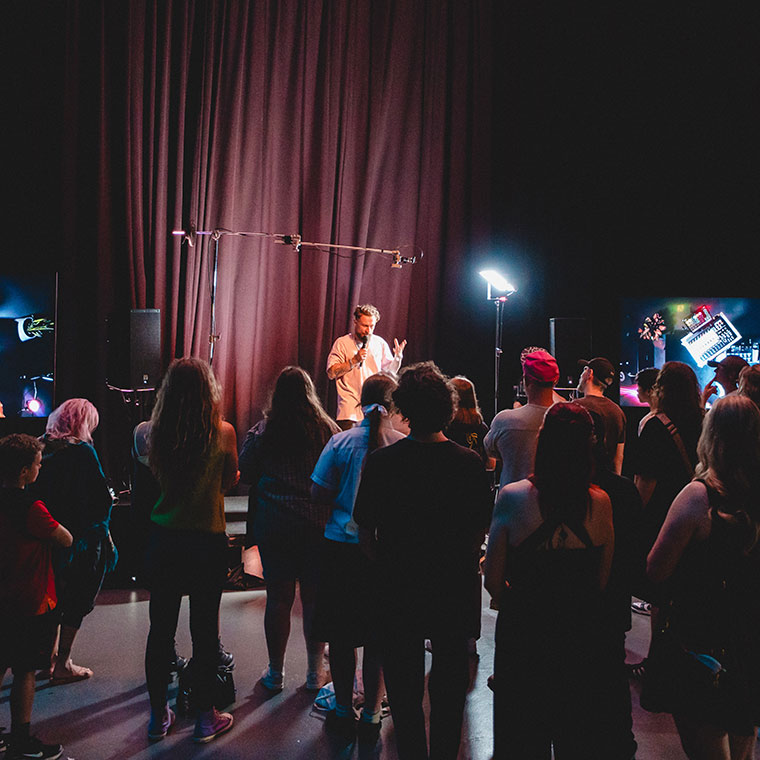 Electronic music producer and performer DubFX (Ben Stafford) speaking to a crowd at The Makers Series #5 - The Art of Live Looping event (760x760)